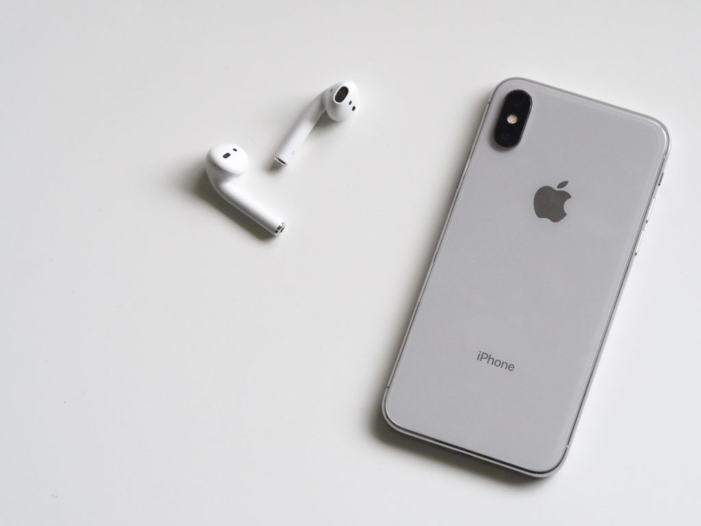 an iphone with earbuds