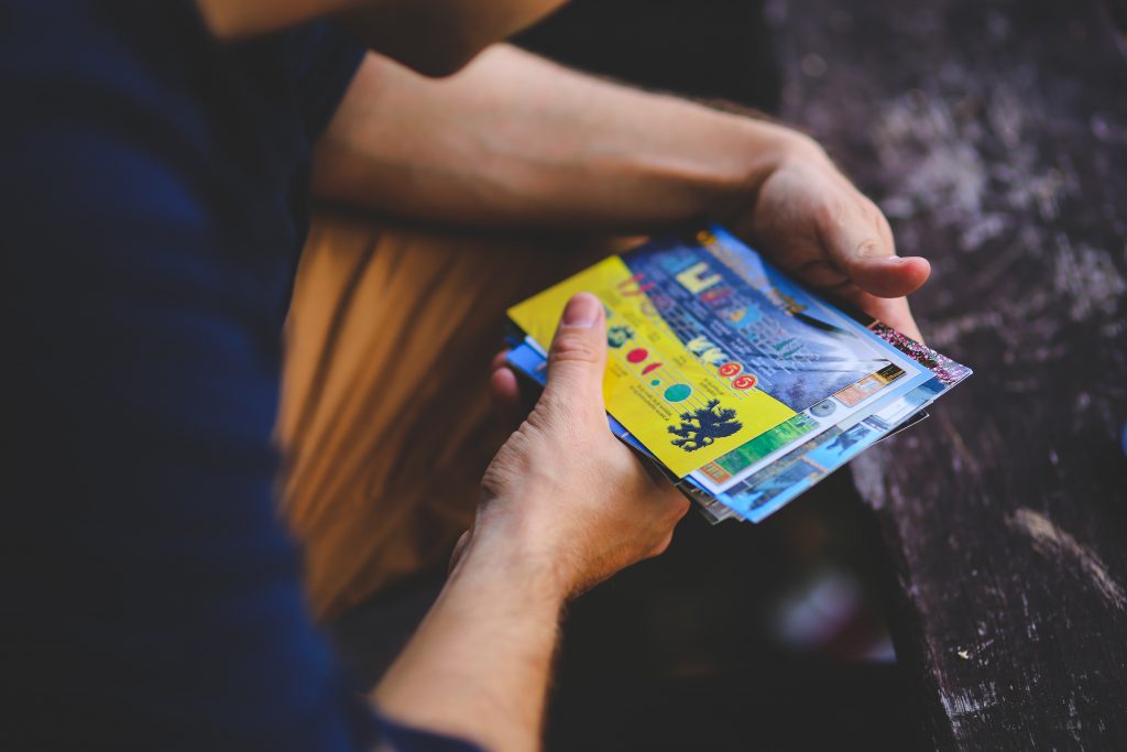 a man holding a brochure