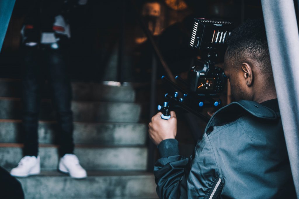 a man holding a video camera 