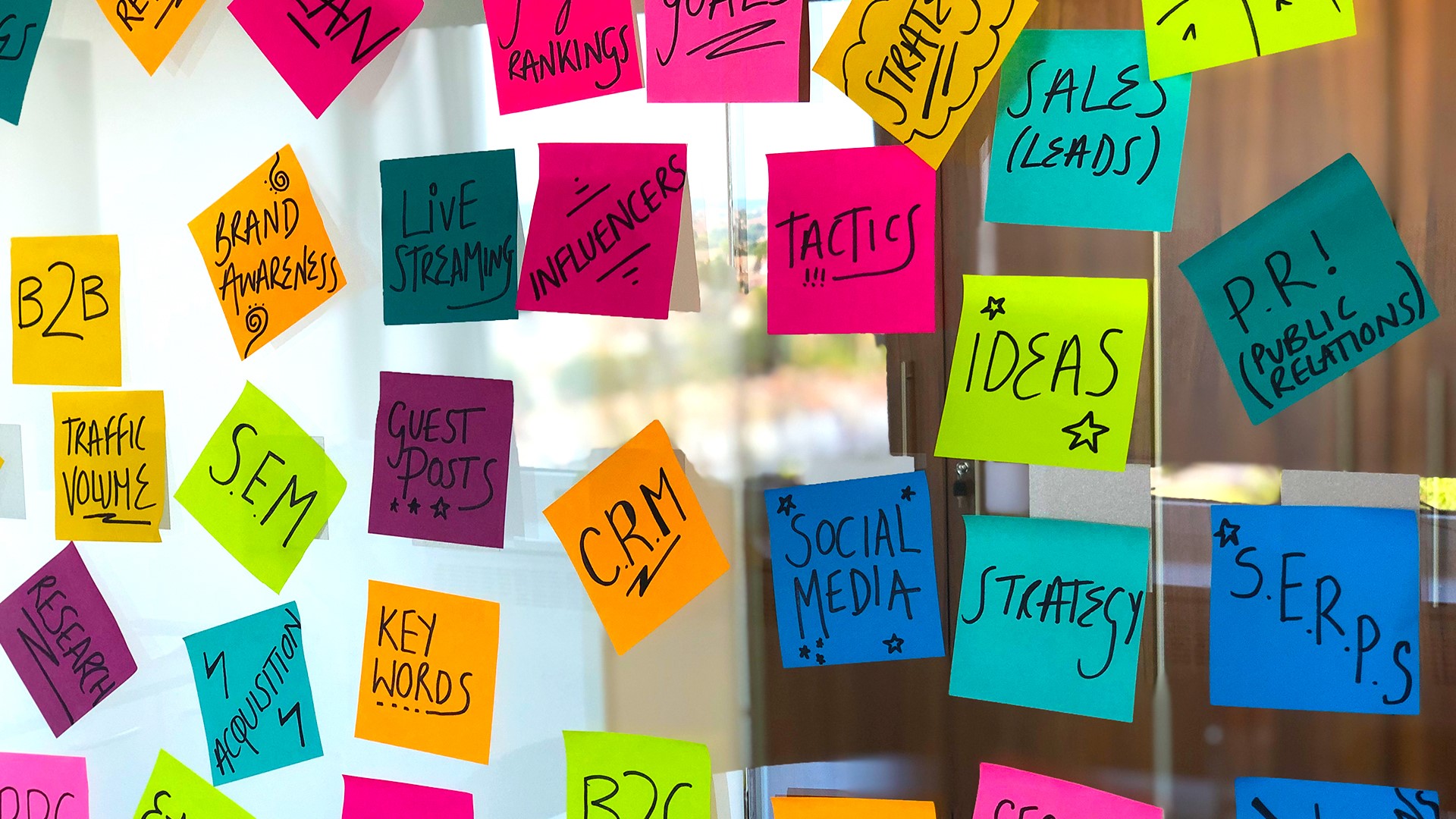 Post it notes with marketing terms written 