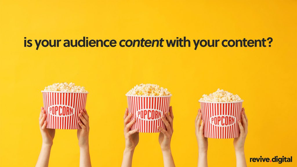 hands holding popcorn in a yellow background 