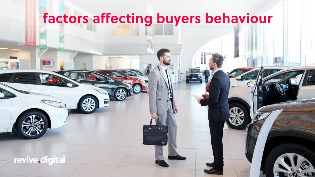 man talking to a car dealer surrounded with cars 