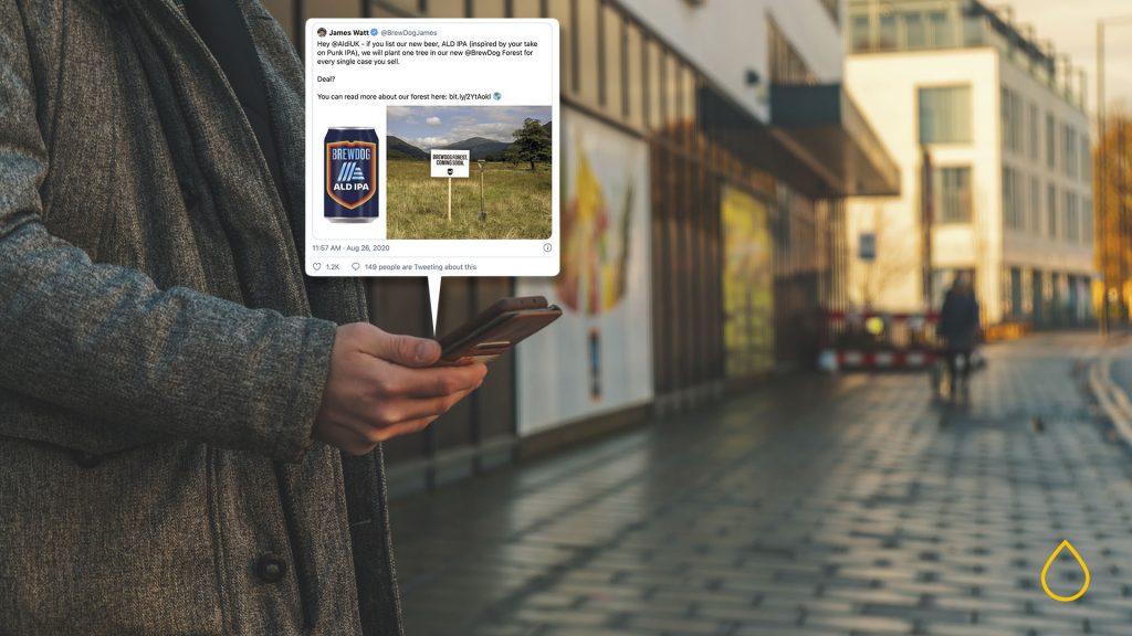 man standing while searching for items in his phone